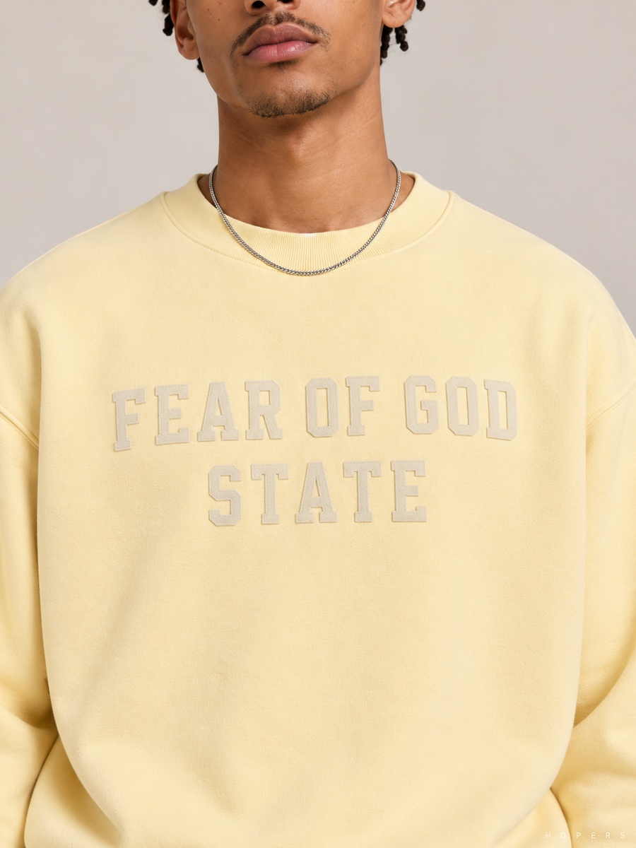 סווטשירט Fear of God Essentials – STATE צהוב חמאה | HOOPERS
