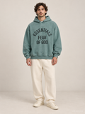קפוצ'ון Fear of God Essentials – Arch Logo טורקיז מכובס | HOOPERS