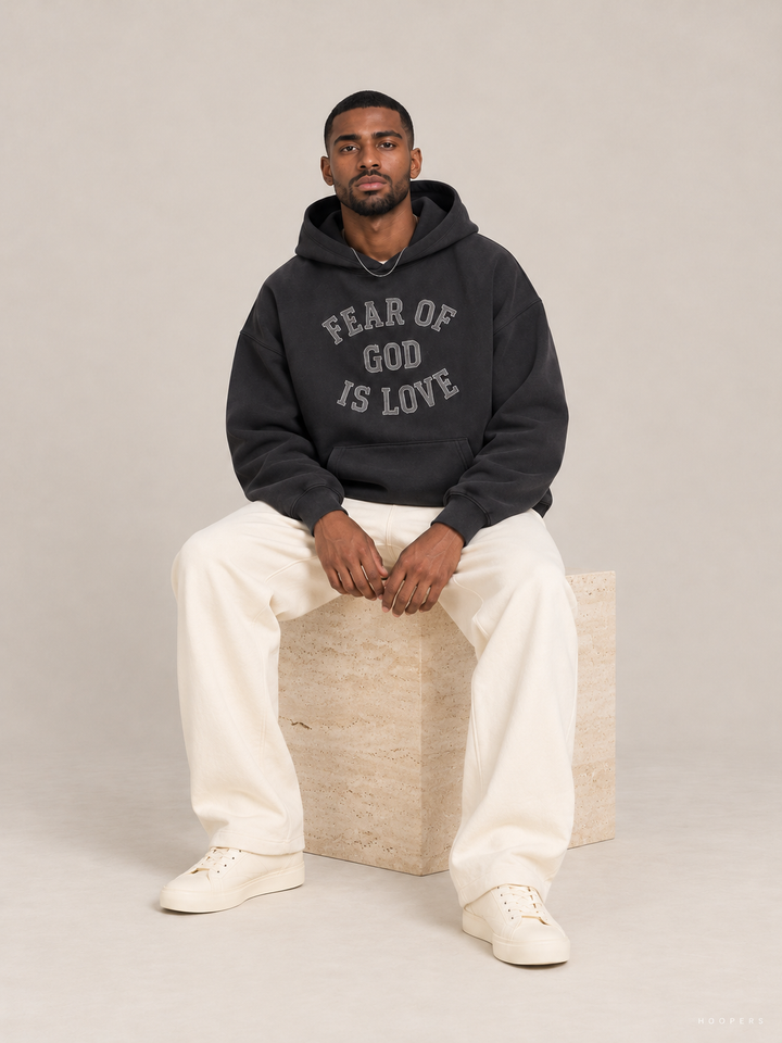 קפוצ'ון Fear of God Essentials – Is Love אפור פחם מכובס – סטודיו
