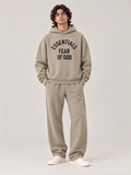 קפוצ'ון Fear of God Essentials – Arch Logo חאקי | HOOPERS