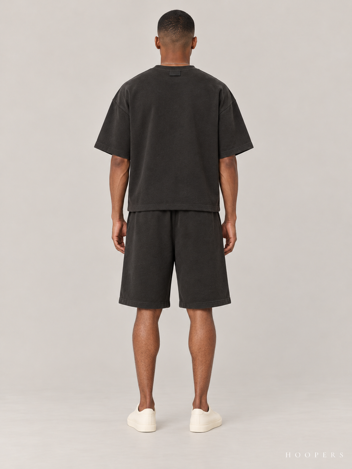 חולצת Fear of God Essentials – Script שחור דהוי – גב