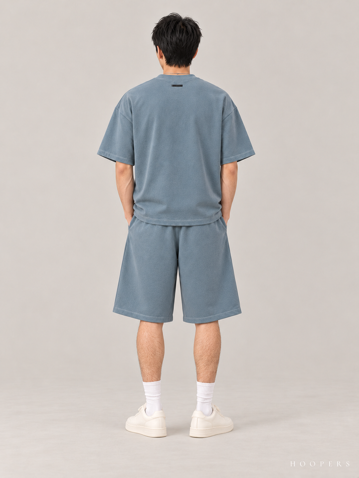 חולצת Fear of God Essentials – Arch Logo כחול אפרפר – גב