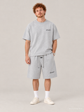חולצת Fear of God Essentials – Script אפור מלאנז' בהיר | HOOPERS