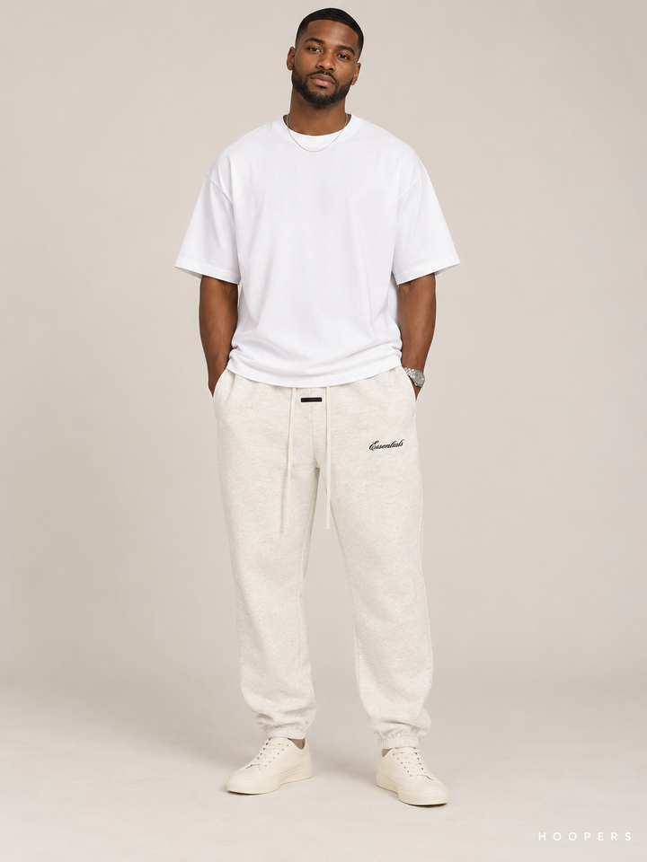 מכנס טרנינג Fear of God Essentials – Script Jogger שמנת מלאנז' – חזית