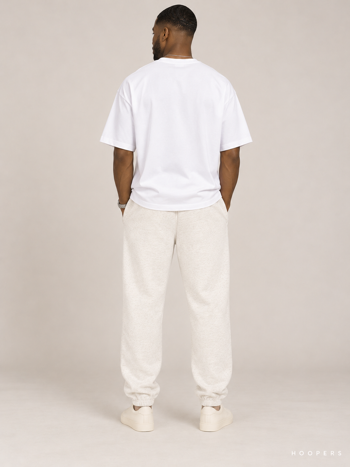 מכנס טרנינג Fear of God Essentials – Script Jogger שמנת מלאנז' – גב