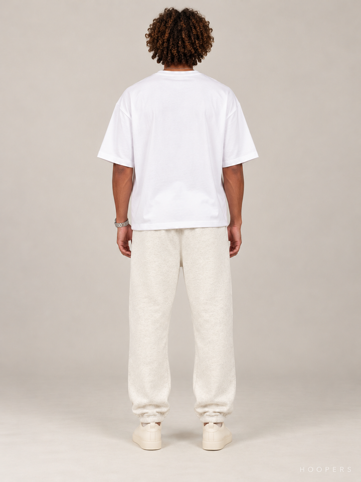 מכנס טרנינג Fear of God Essentials – Arch Jogger שמנת מלאנז' – גב