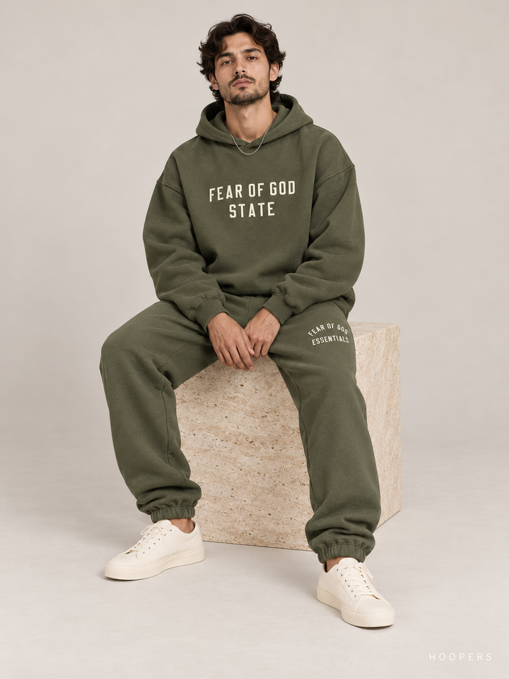 מכנס טרנינג Fear of God Essentials – Arch Jogger ירוק זית – סטודיו