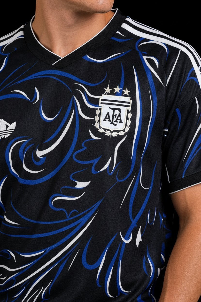 Hoopers black Argentina football jersey with blue and white swirl graphic, V-neck, and Adidas stripes on sleeves.