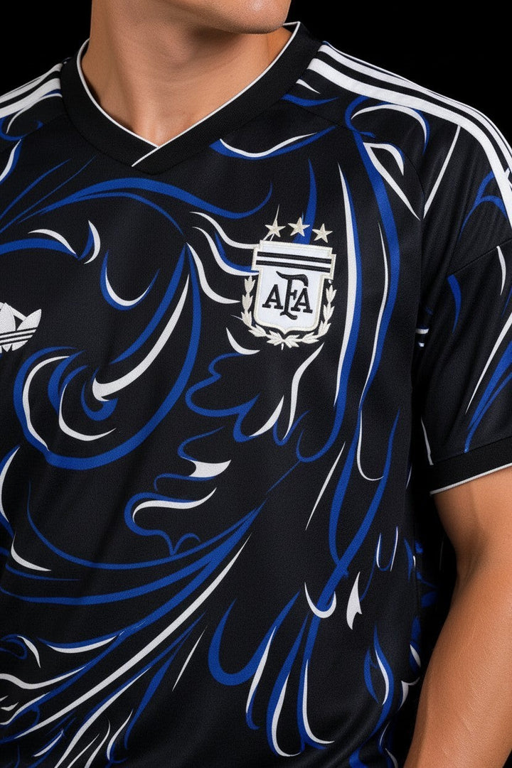Hoopers black Argentina football jersey with blue and white swirl graphic, V-neck, and Adidas stripes on sleeves.