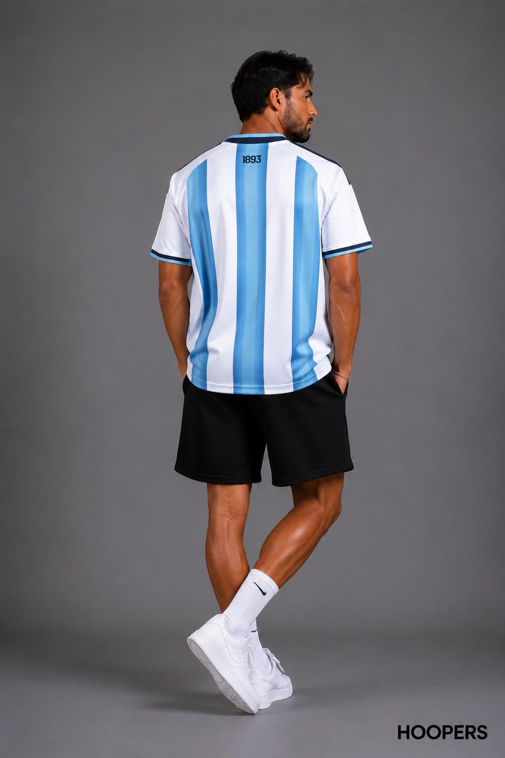Hoopers Sky Blue Home Edition Argentina football jersey with white and light blue vertical stripes and gold details.