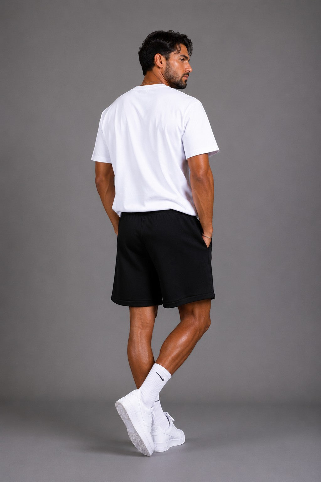 Hoopers black Fear Of God Shadow State sweat shorts with drawstring and side pockets, worn by a man.