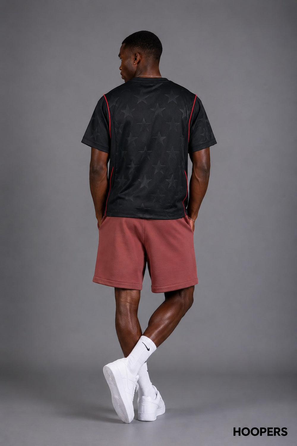 Hoopers black t-shirt with subtle star pattern and red trim, short sleeves, crew neck, relaxed fit.