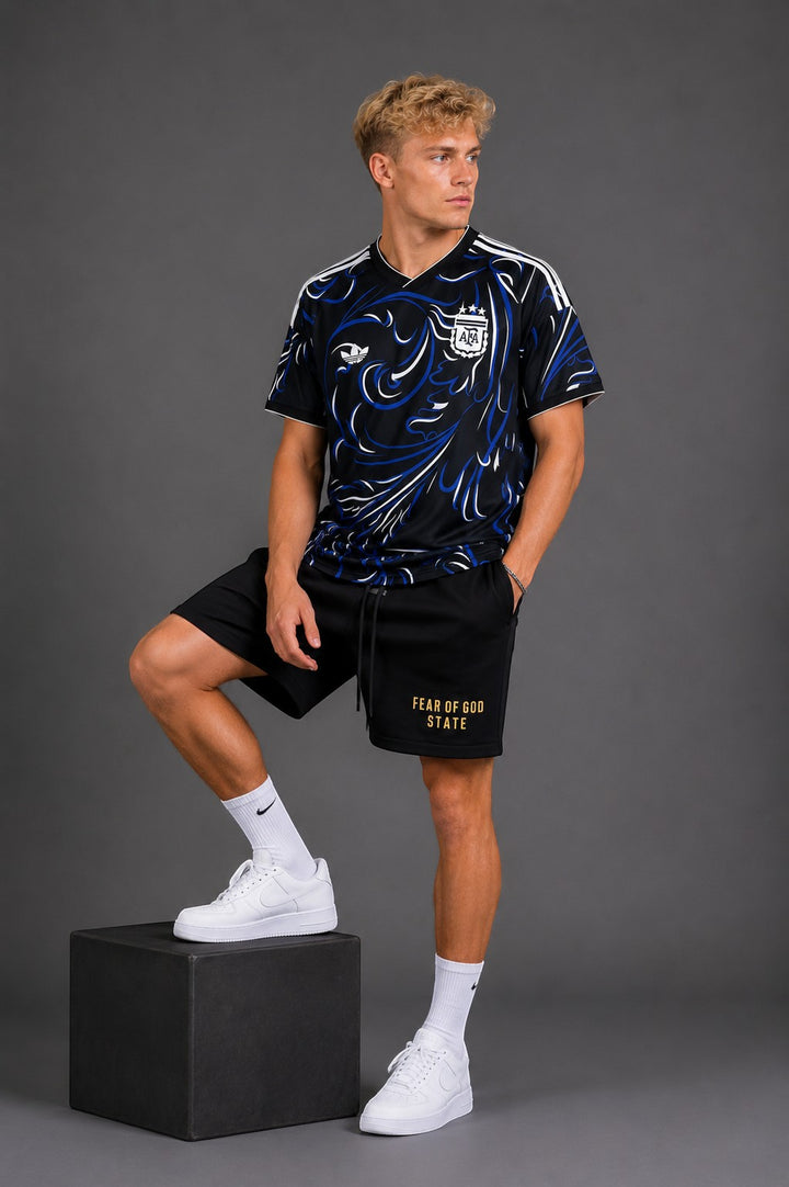 Hoopers black t-shirt with blue and white swirl graphic, inspired by Argentina football. V-neck, short sleeves.