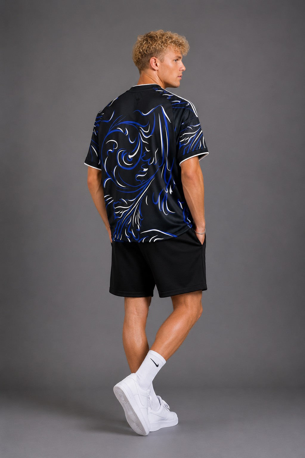 Hoopers black t-shirt with blue and white swirl graphic print, short sleeves, crew neck, and white trim.