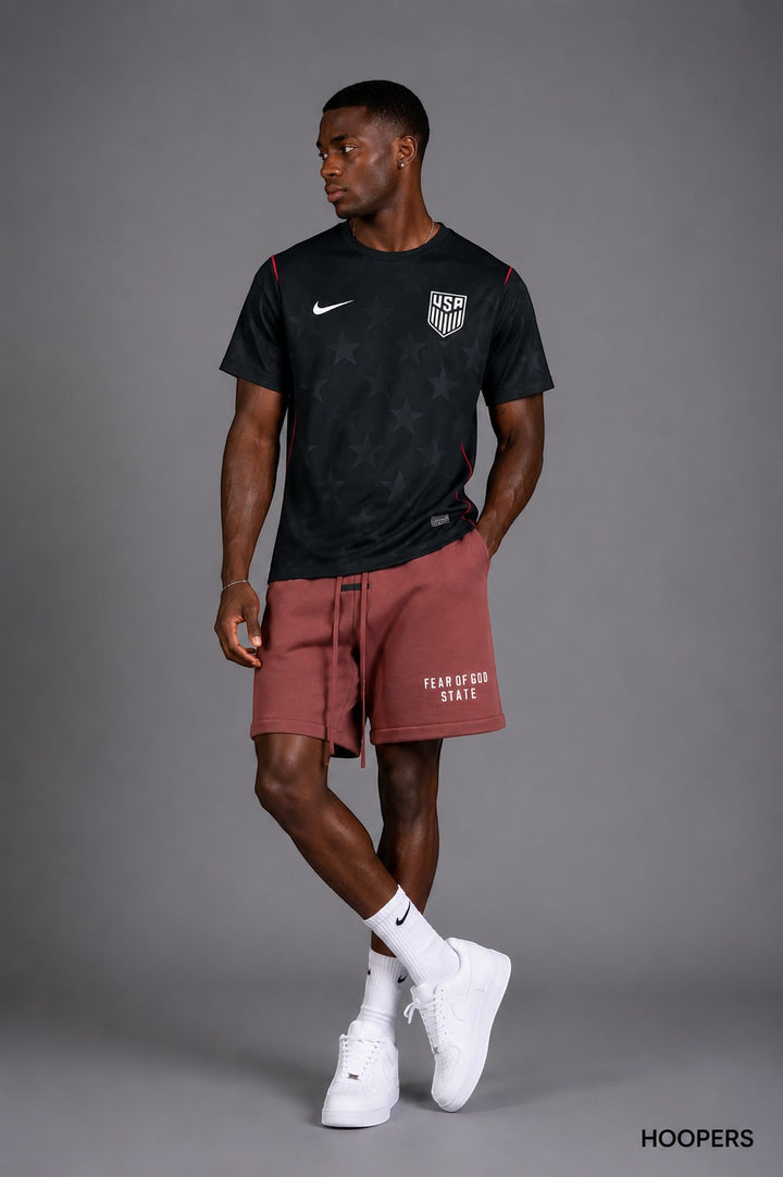 Hoopers black USA soccer jersey with subtle star pattern and red trim, short sleeves, crew neck.
