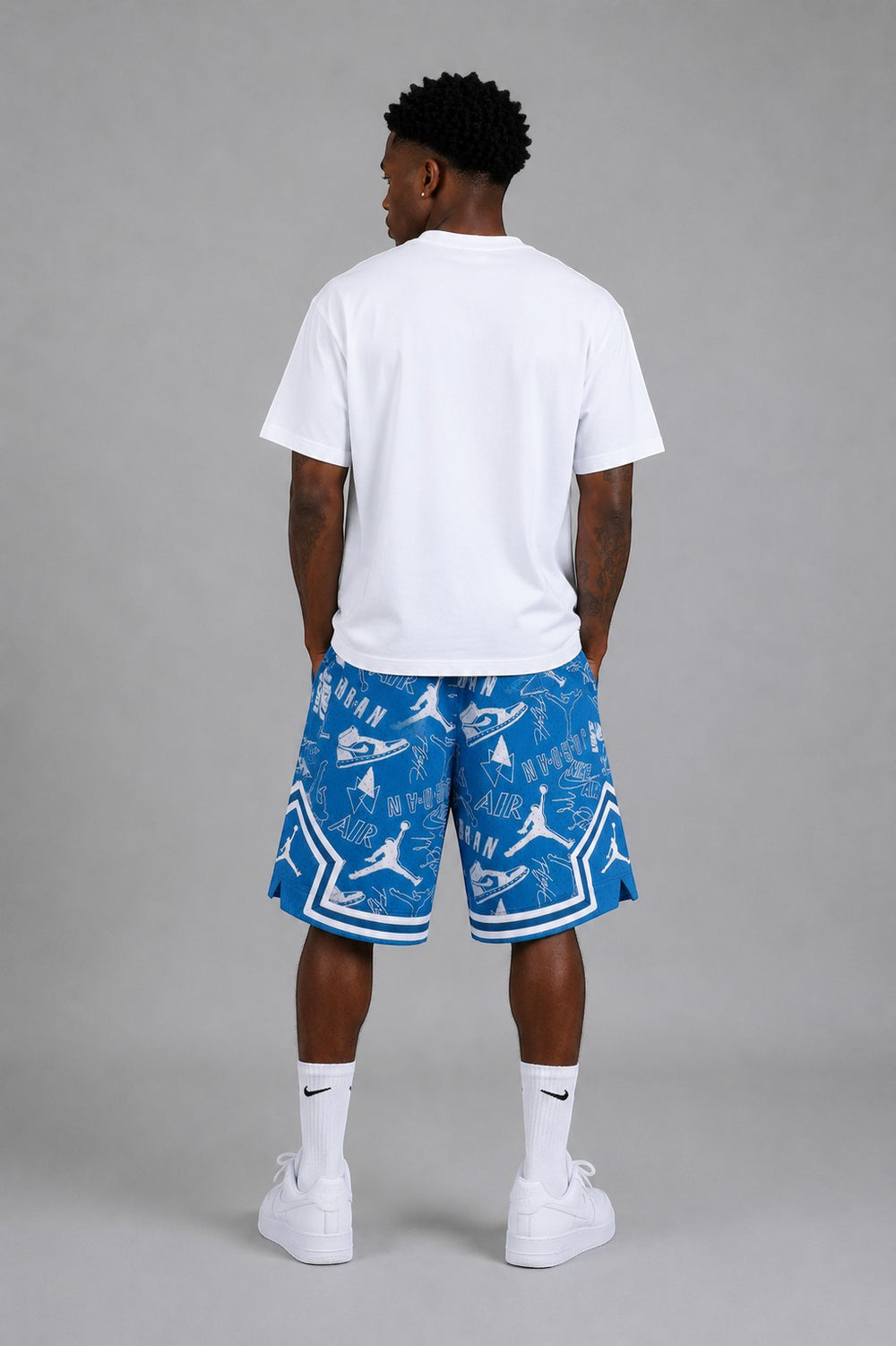 Hoopers men's blue mesh shorts with all-over white Jordan icon pattern and white trim. Oversized fit.