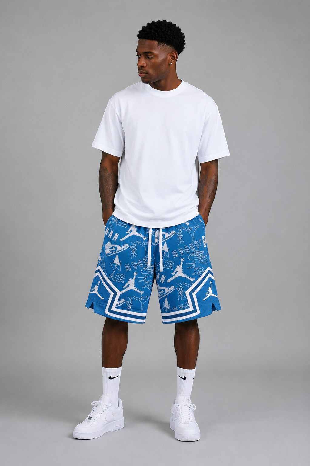 Hoopers blue mesh shorts with all-over white Jordan icon pattern and white trim. Men's oversized fit.
