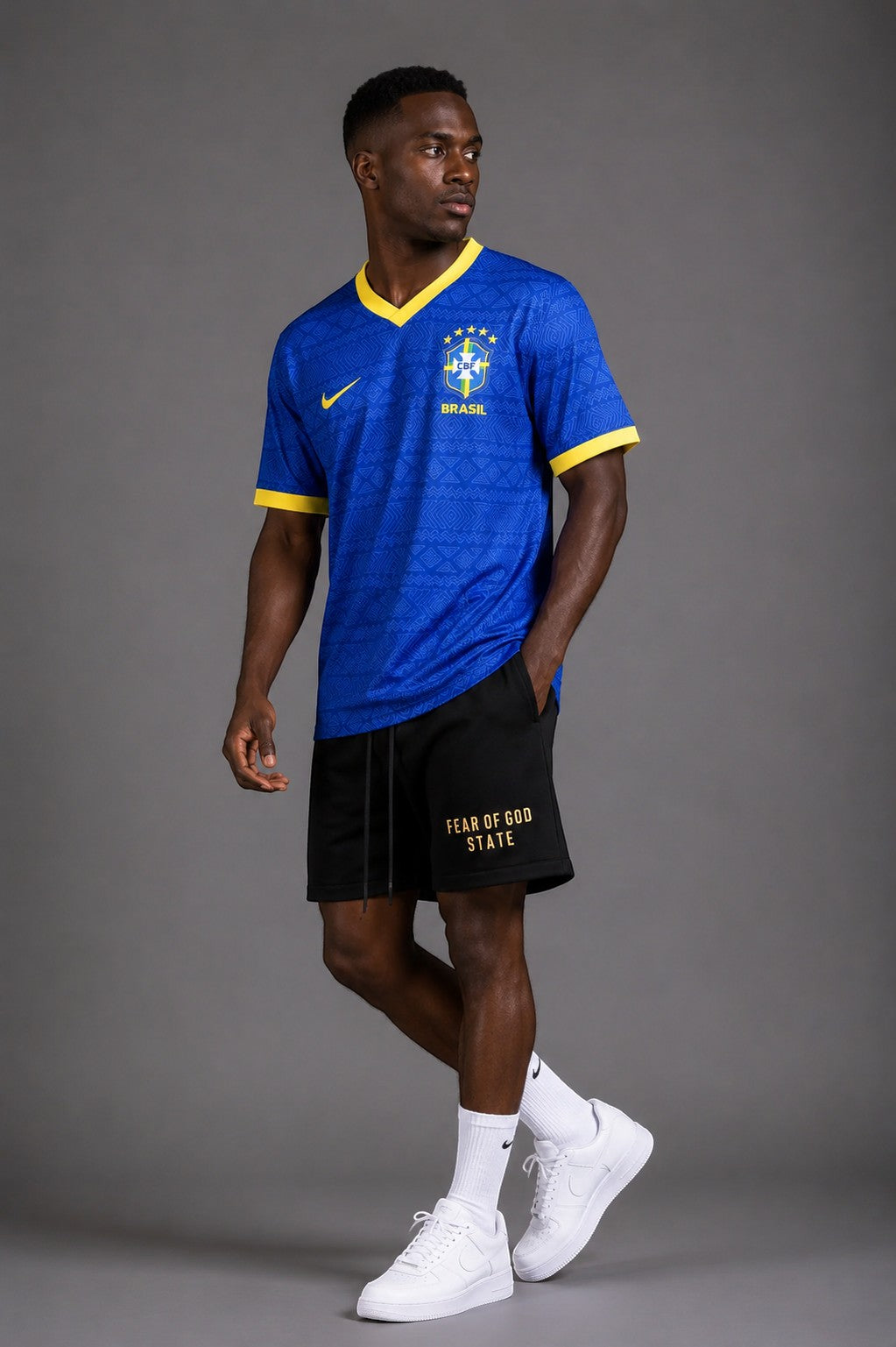 Hoopers men's royal blue Brazil World Cup jersey with yellow trim and subtle geometric pattern. Features classic CBF crest.