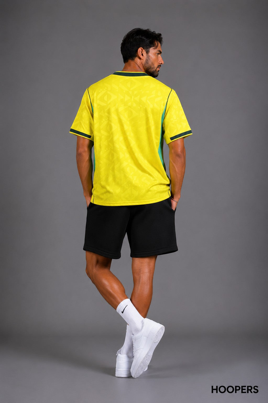 Hoopers men's yellow Brazil World Cup jersey with green accents and subtle geometric pattern. Loose fit.