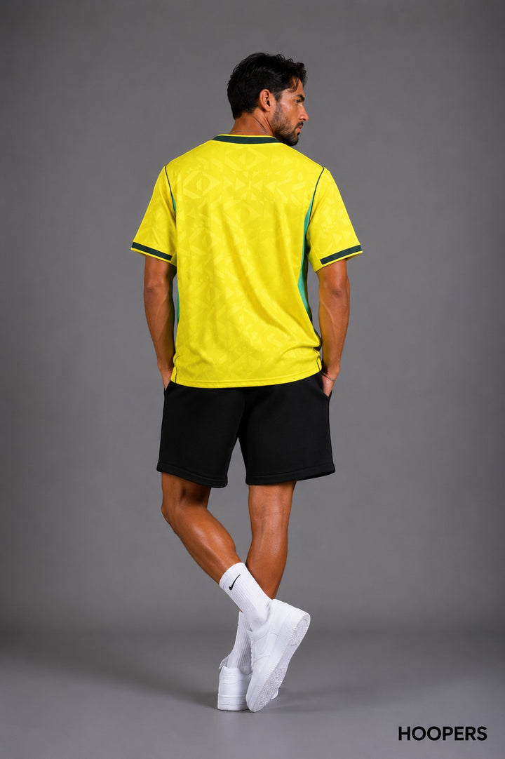 Hoopers men's yellow Brazil World Cup jersey with green accents and subtle geometric pattern. Loose fit.