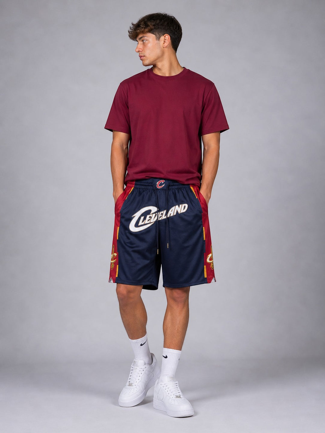 Hoopers men's navy NBA shorts with red and gold side panels, featuring Cleveland Cavaliers branding. Lightweight mesh material.
