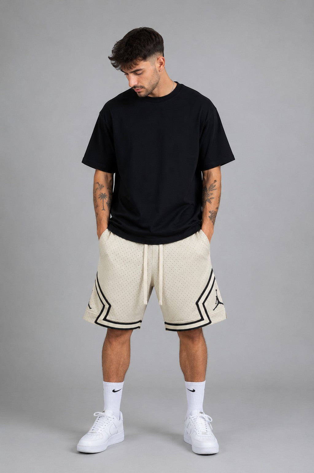Hoopers men's cream vintage mesh basketball shorts with black trim and Jordan logo. Relaxed fit.
