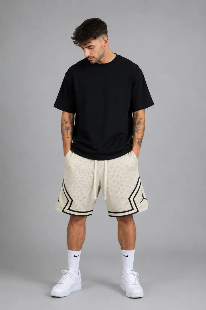 Hoopers men's cream vintage mesh basketball shorts with black trim and Jordan logo. Relaxed fit.