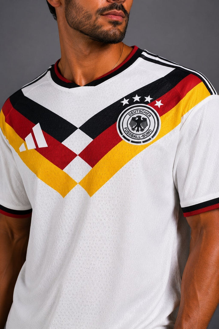Hoopers white Germany retro football jersey with black, red, and yellow accents. Features classic crest and stripes.