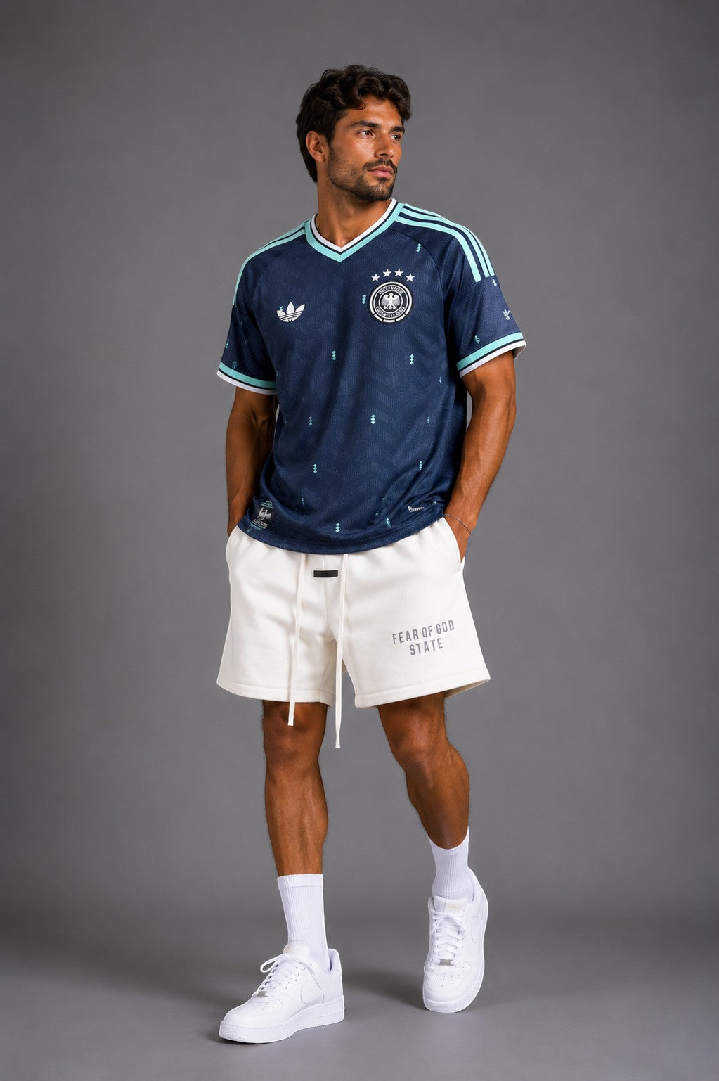Hoopers Germany World Cup jersey in navy with mint green accents, featuring a classic v-neck and Adidas stripes.