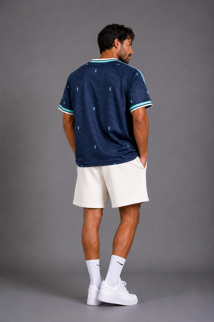 Hoopers Germany World Cup jersey in navy with mint green accents, featuring a subtle geometric pattern and striped collar/cuffs.