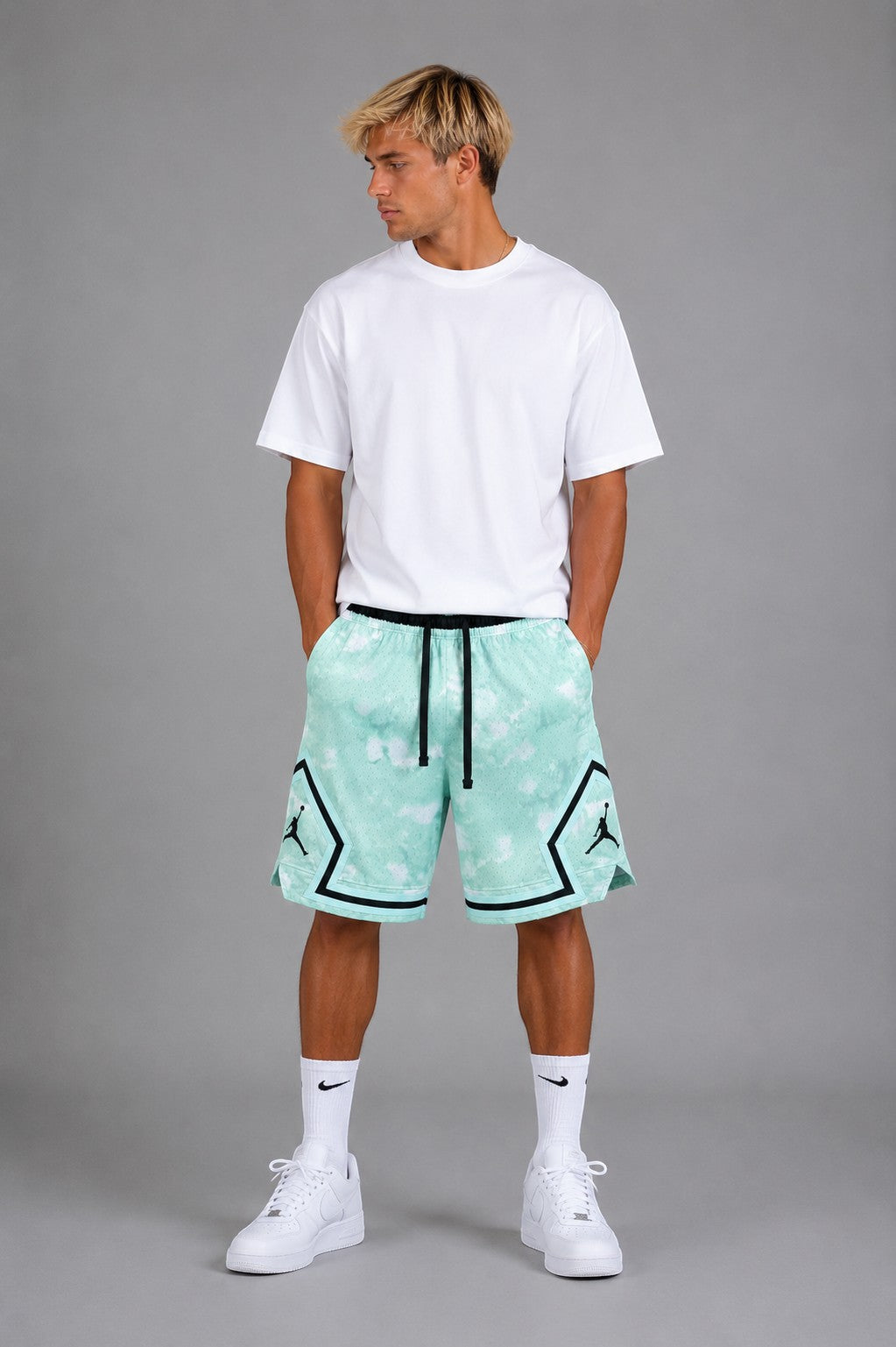 Hoopers Jordan mint cloud mesh shorts with black trim and Jumpman logo. Relaxed fit, ideal for summer.
