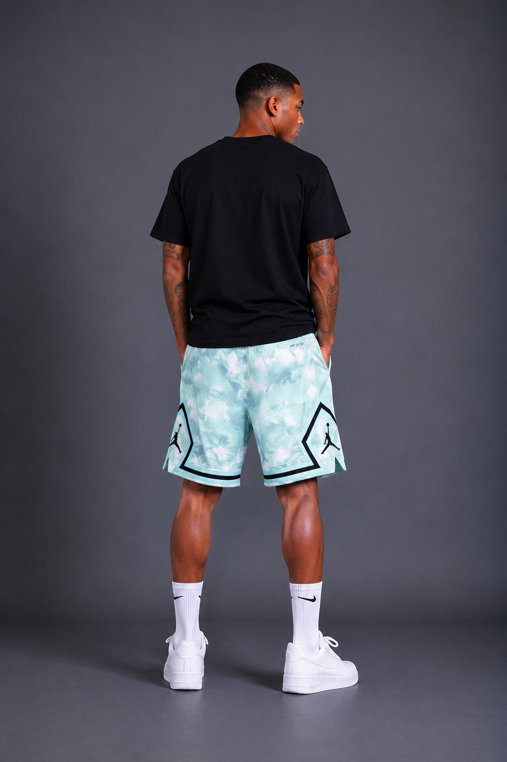 Hoopers Jordan Mint Cloud Edition mesh shorts with a tie-dye pattern in mint and white, featuring black trim and Jumpman logos.