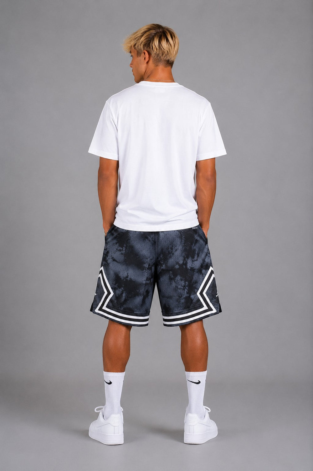 Hoopers Jordan Shadow Smoke basketball shorts in black and grey tie-dye mesh with white trim and side pockets.