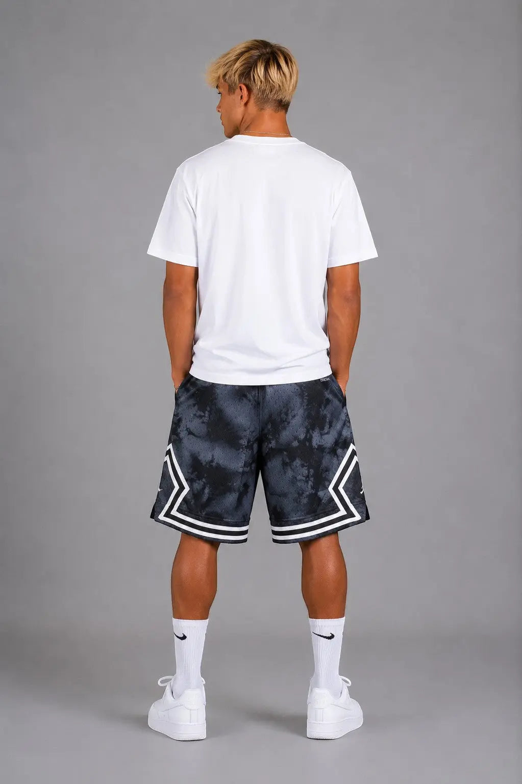 Hoopers Jordan Shadow Smoke basketball shorts in black and grey tie-dye mesh with white trim and side pockets.