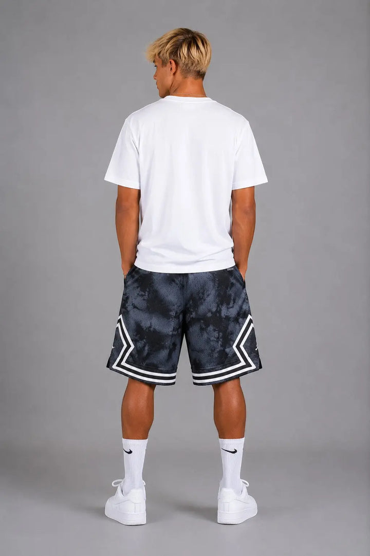 Hoopers Jordan Shadow Smoke basketball shorts in black and grey tie-dye mesh with white trim and side pockets.