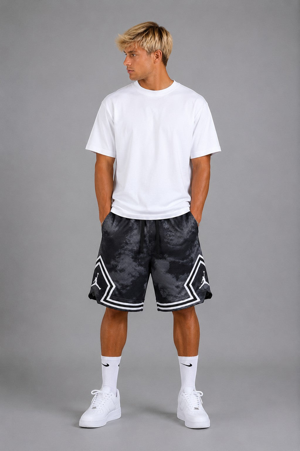 Hoopers Jordan Shadow Smoke basketball shorts in black and grey with a tie-dye effect and white trim. Men's oversized fit.