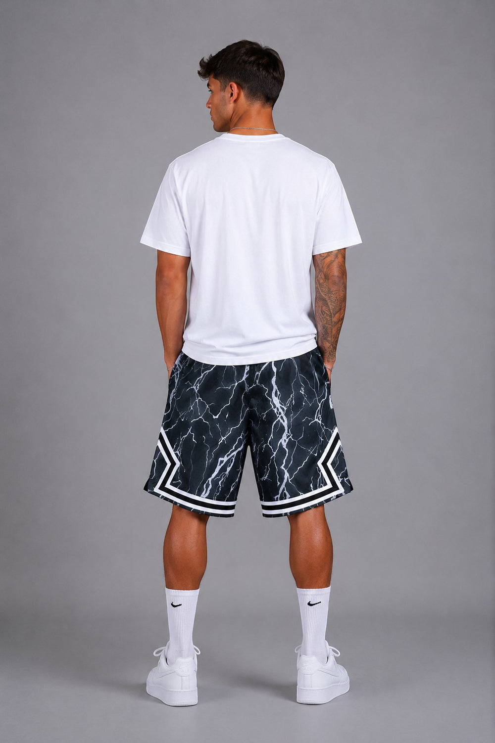 Hoopers men's black marble print basketball shorts with white lightning accents and white trim.