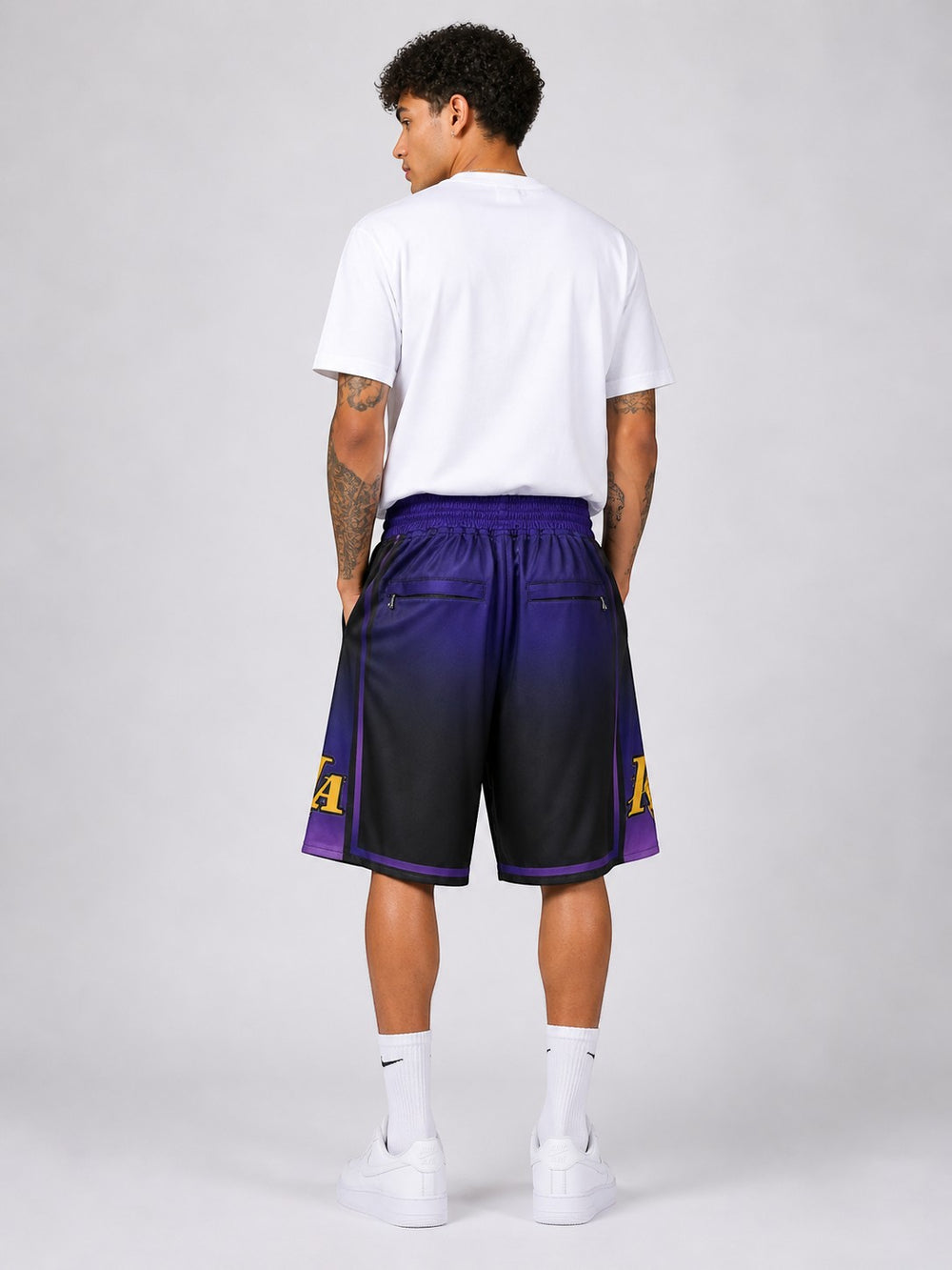 Hoopers men's black and purple Lakers basketball shorts with gold trim and "LakeShow" print. 100% polyester mesh.