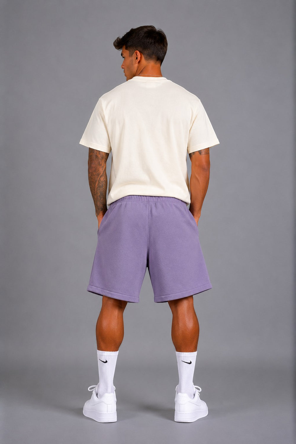 Hoopers lilac purple oversized sweat shorts with drawstring and side pockets, worn by a man.