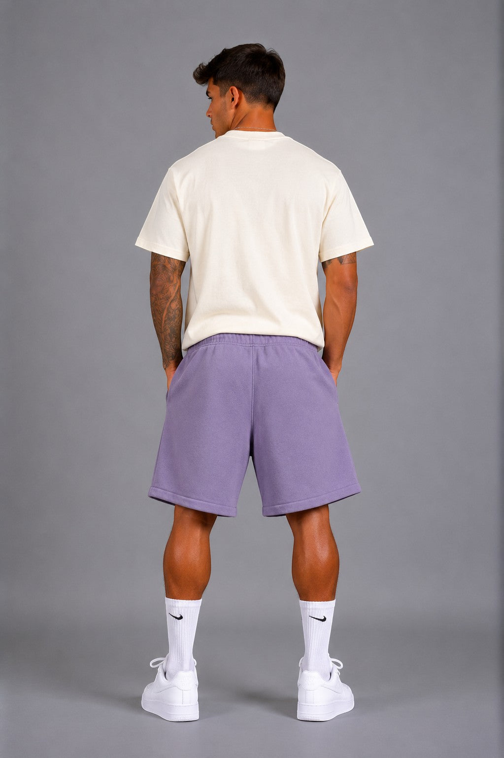 Hoopers lilac purple oversized sweat shorts with drawstring and side pockets, worn by a man.