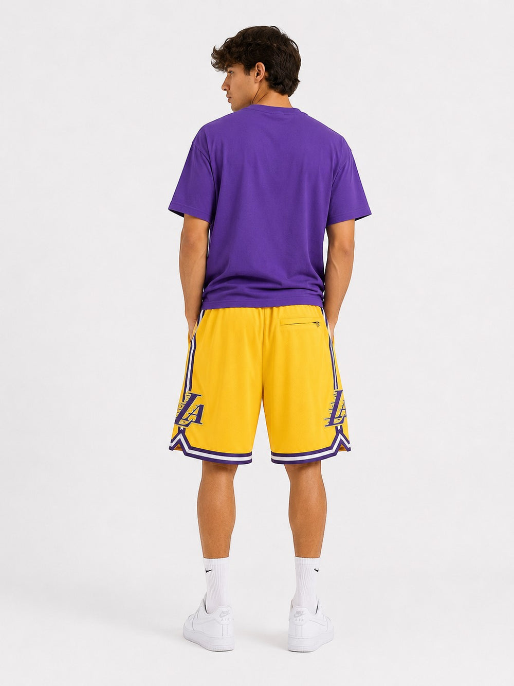 Hoopers yellow Los Angeles Lakers basketball shorts with purple and white trim. Features Lakers logo on sides.