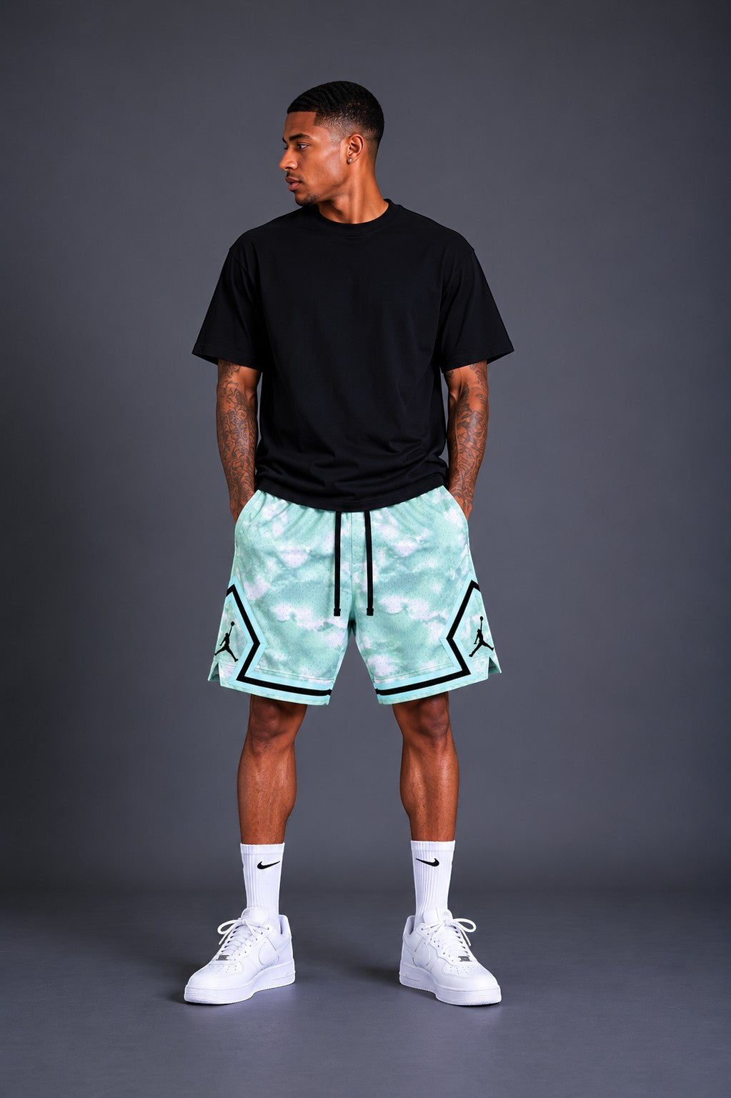 Hoopers men's mint green and white tie-dye mesh basketball shorts with black trim and Jordan logos.