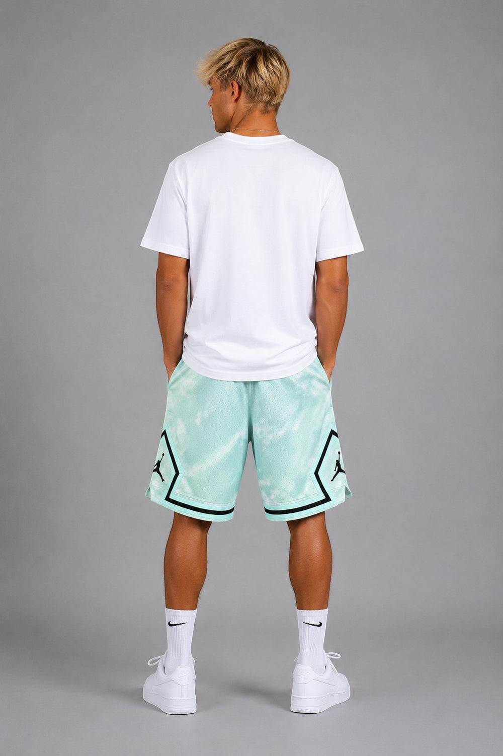 Hoopers men's mint and white mesh basketball shorts with cloud pattern and black trim.