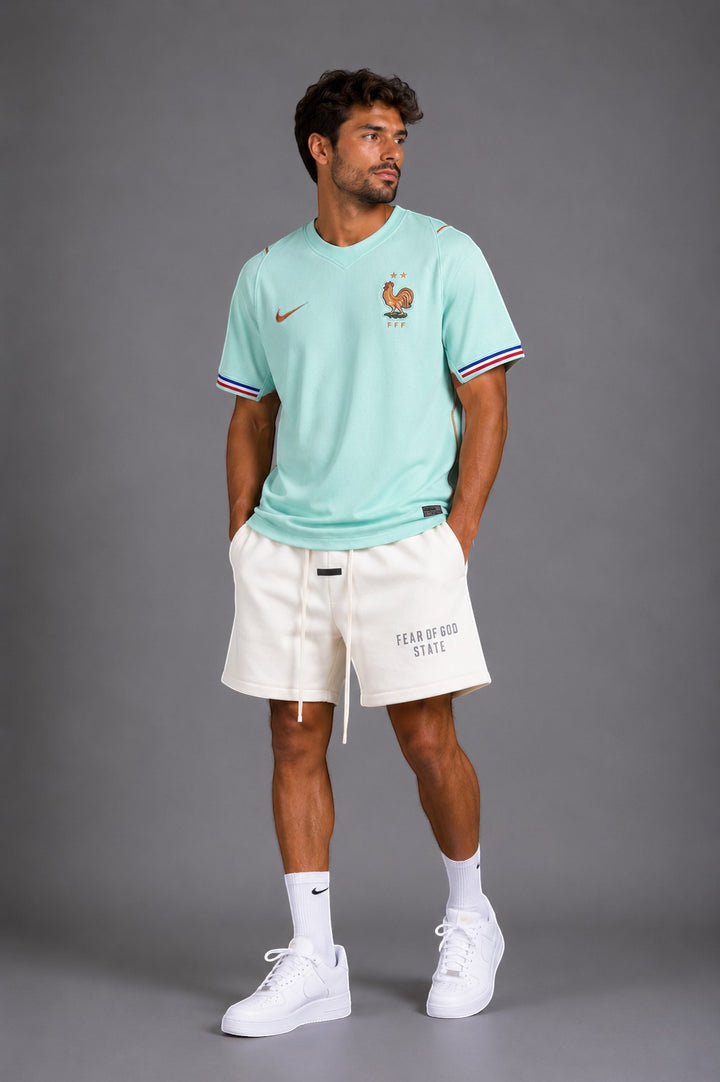 Hoopers mint green France World Cup jersey with retro trim and FFF logo. Model wears oversized fit.