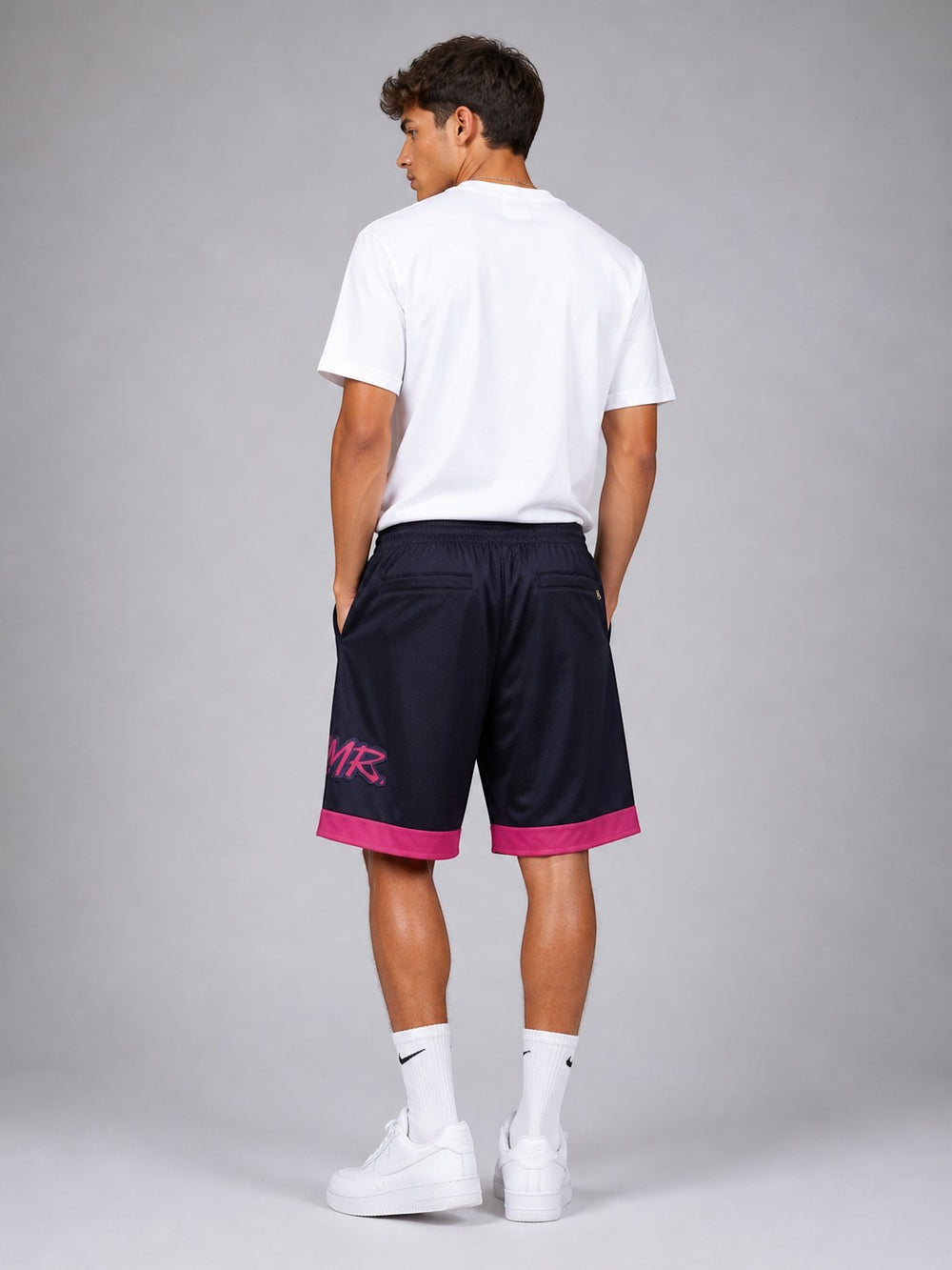 Hoopers NBA shorts in navy with pink trim and logo, featuring a relaxed fit and mesh fabric.