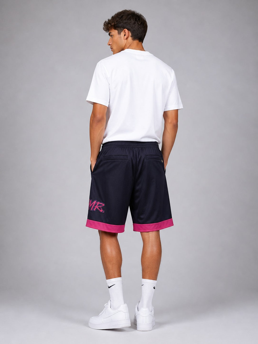 Hoopers NBA shorts in navy with pink trim and logo, featuring a relaxed fit and mesh fabric.