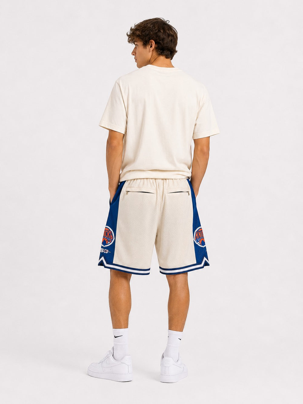 Hoopers New York Knicks retro basketball shorts in cream with blue and orange accents. Mesh fabric with embroidered logos.