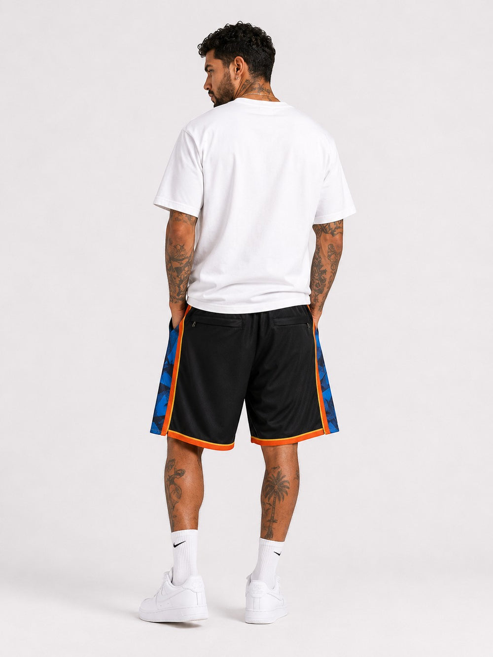 Hoopers black basketball shorts with blue and orange trim, featuring Oklahoma City Thunder graphic details.