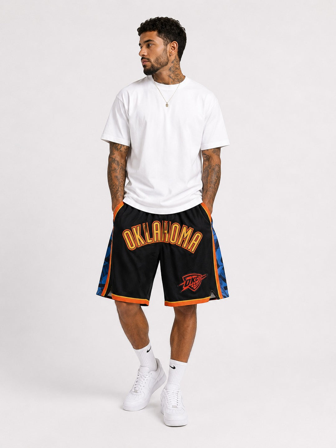 Hoopers black NBA shorts with Oklahoma City Thunder logo in blue and orange, wide basketball fit.