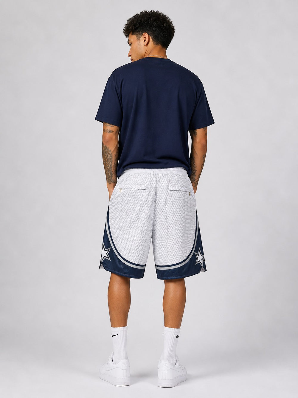 Hoopers white and navy blue retro Orlando Magic basketball shorts with star accents, made of polyester mesh.